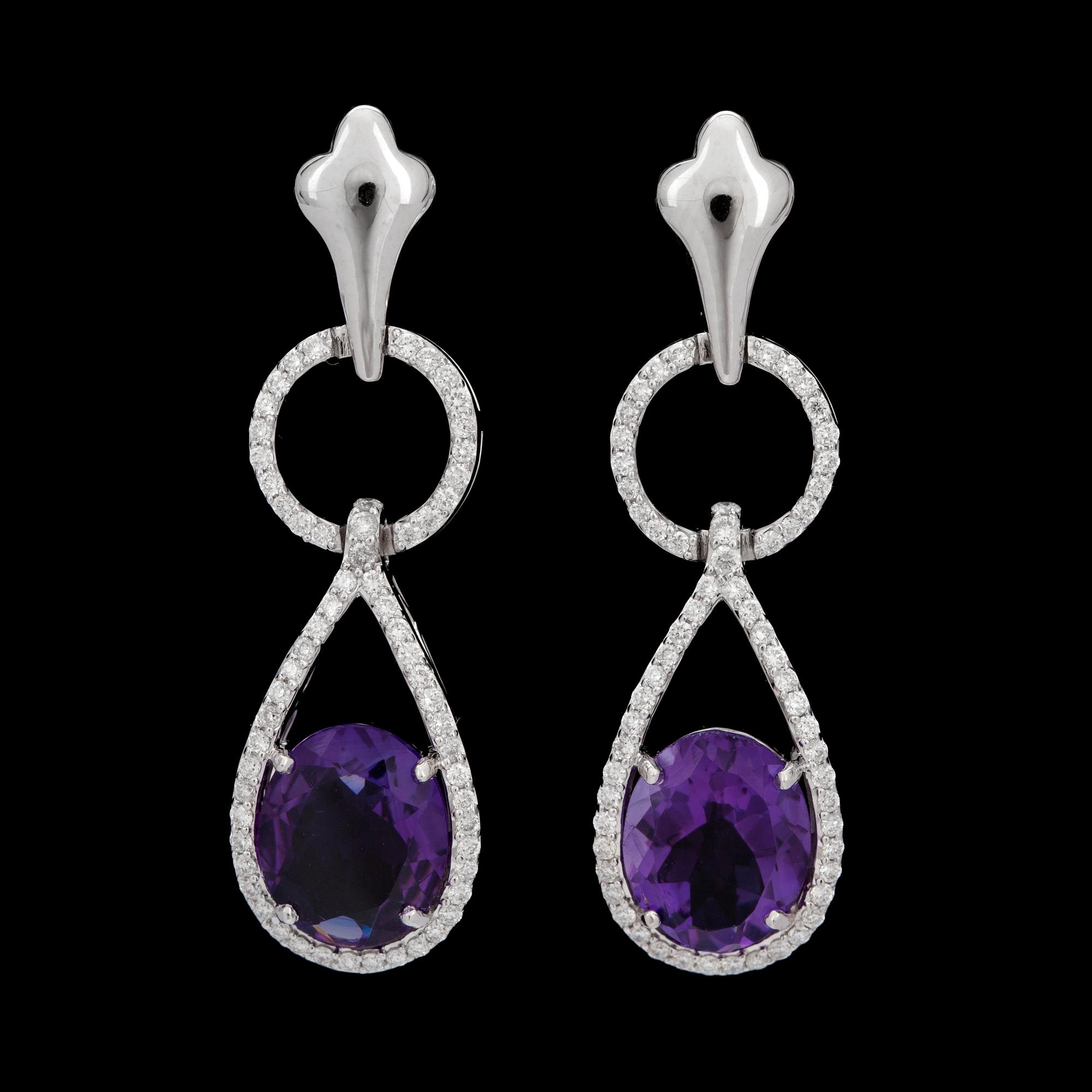 A pair of amethyst and diamond earrings. Amethysts 3.96 cts. Diamonds 0.62 ct.
