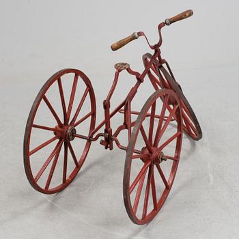 An early 20th century tricycle bike.