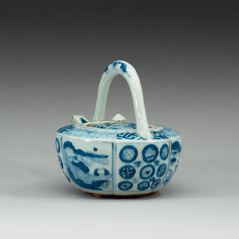 A blue and white Japanese tea pot with cover.