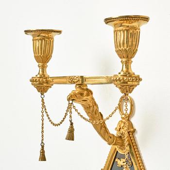 A pair of two-branch late Louis XVI ormolu and blued steel appliques attr. to F. Rémond (bronzier in Paris 1774-1812).