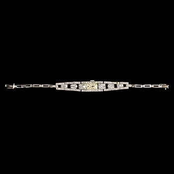 1103. LADIES DIAMOND WRIST WATCH, Doxa, brilliant- and eight cut diamonds, tot. app. 2.50 ct. 1930's.