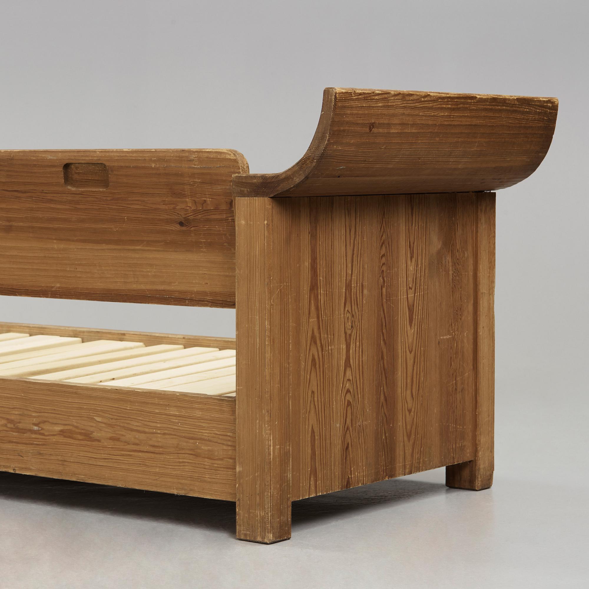 An Axel Einar Hjorth stained pine sofa 'Sandhamn', Nordiska Kompaniet 1933.