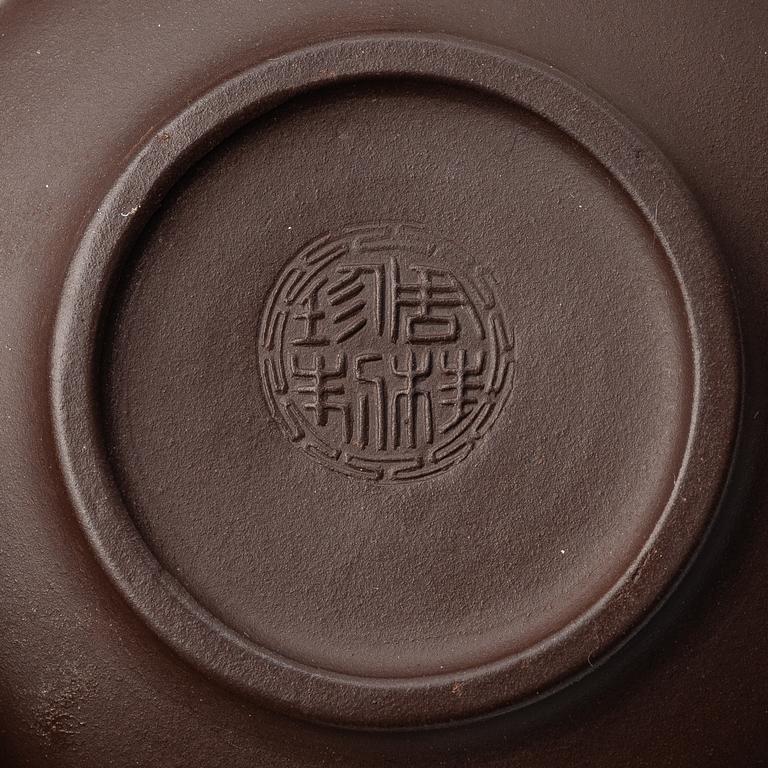 Two yixing teapots, China, 1980s and 2000.