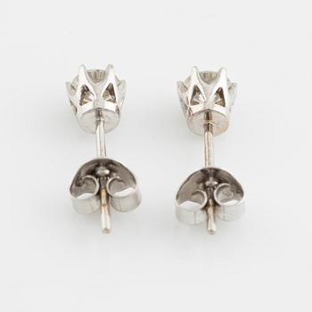 Brilliant cut diamond stud earrings.