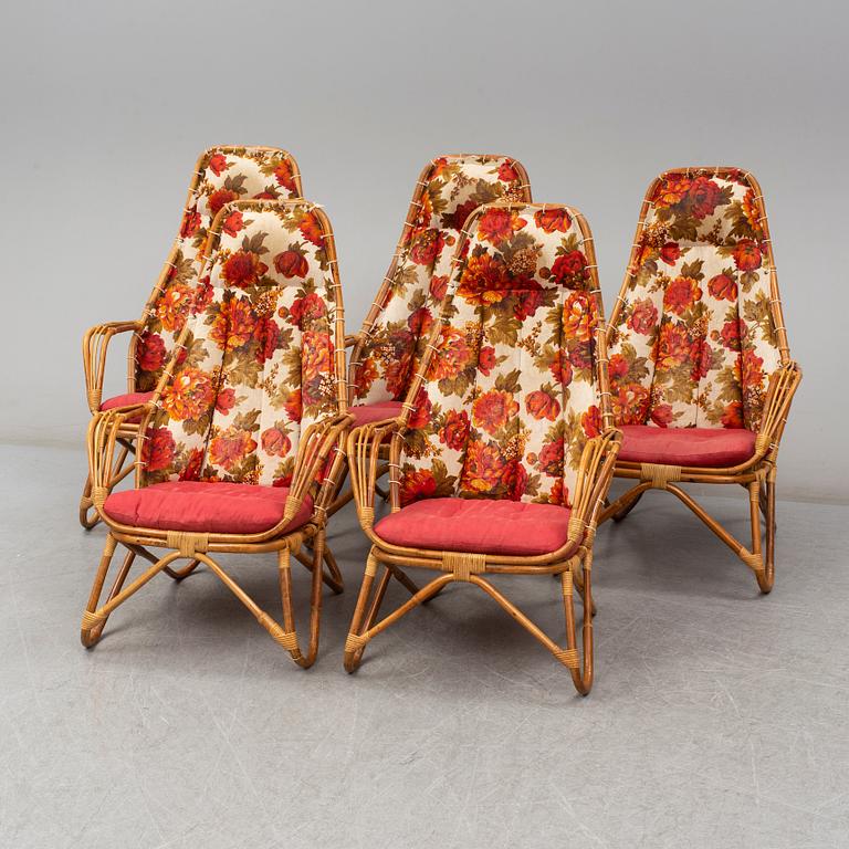 A set of 5 armchairs and a table, second half of the 20th century.