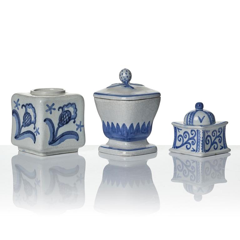 Wilhelm Kåge, eleven pieces of faience including jars, inkwells and a tulip vase, Gustavsberg, Sweden, 1919-1920.