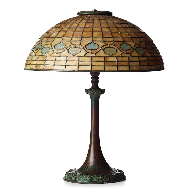 TIFFANY STUDIOS, an Art Nouveau "Vine Border" shade on a "Double Scroll" bronze base table lamp, New York 1902-1918.