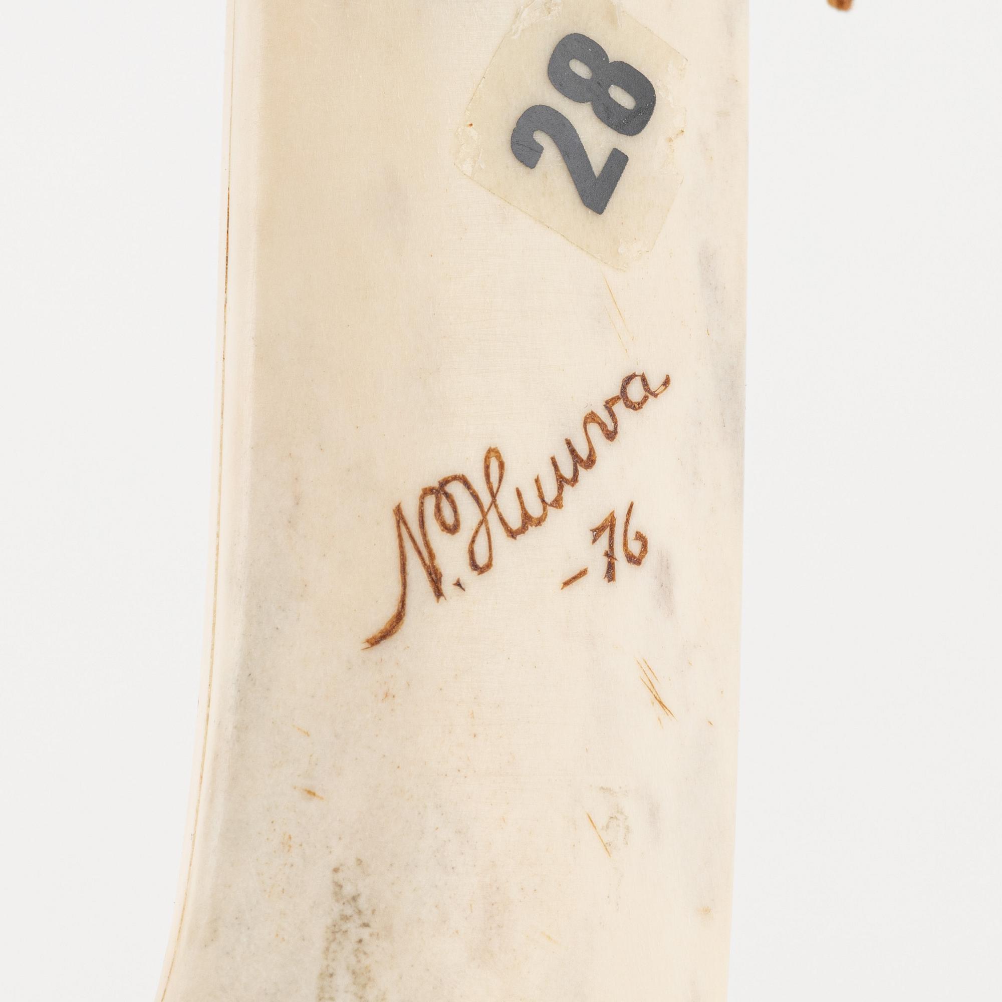 Nils Huuva, a reindeer horn knife, signed and dated -76.