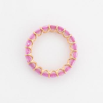 Oval faceted pink sapphire ring.