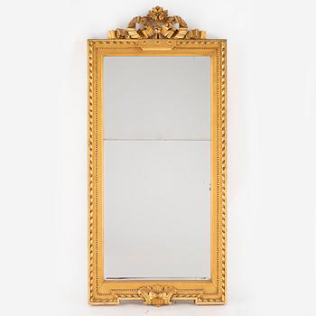 A giltwood and parcel-gilt gustavian mirror by J. Åkerblad (Master in Stockholm 1758-1799).