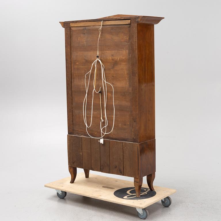 A mahogany veneered book cabinet. 19th Century.