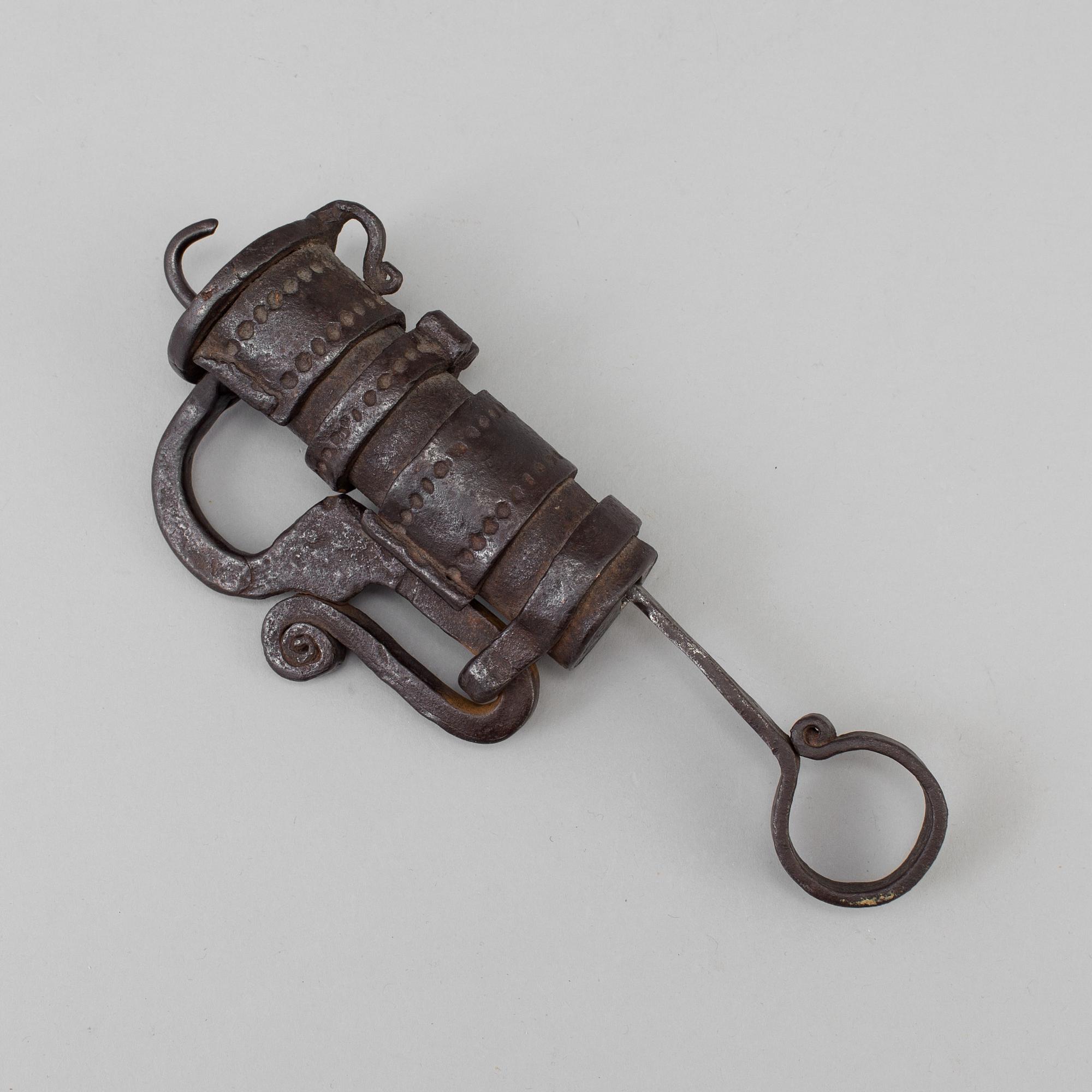 a 1700's-/1800's lock with a key.