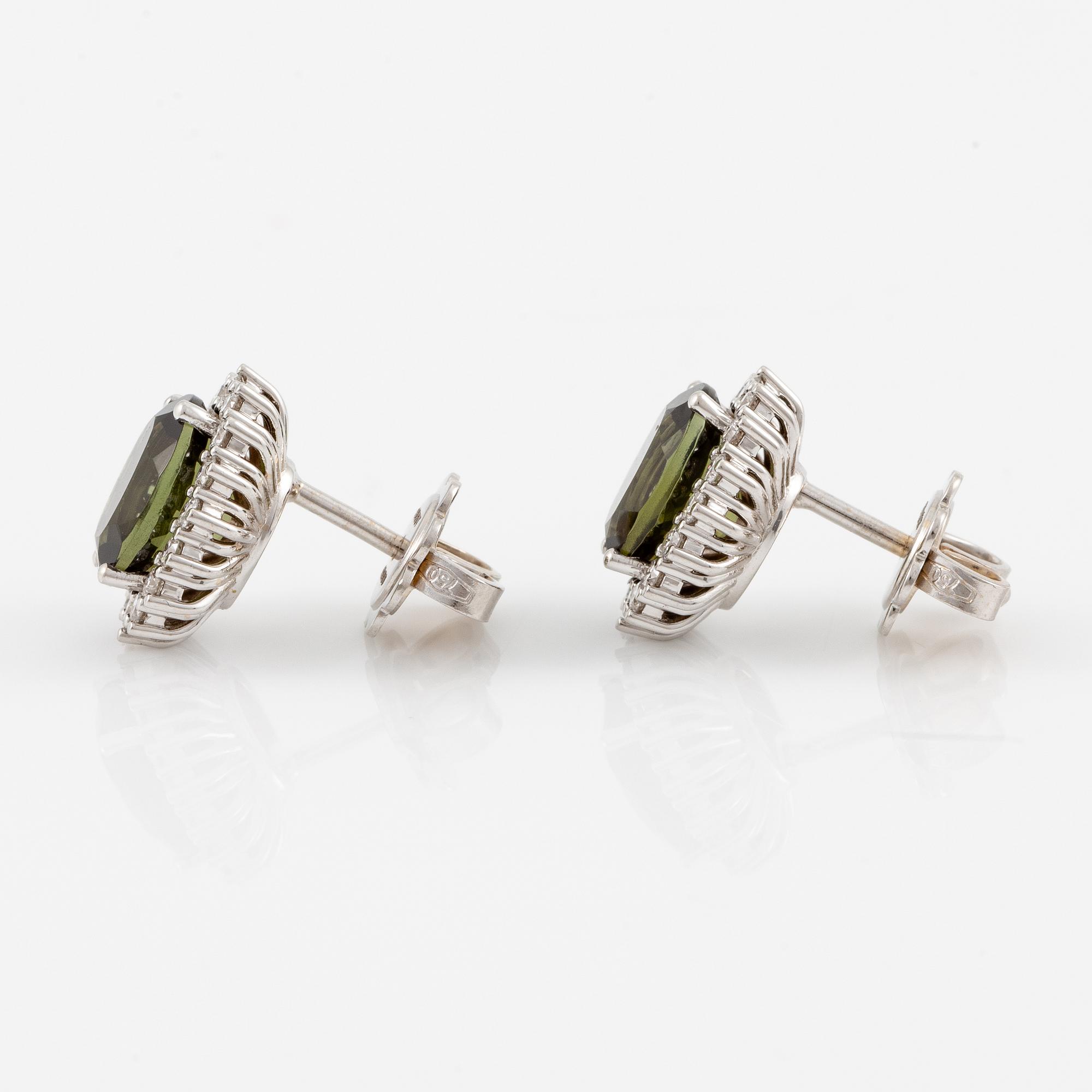 Earrings with green tourmalines and brilliant-cut diamonds.