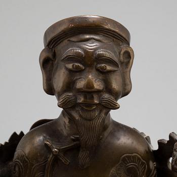 A Chinese bronze sculpture of a deity, 20th century.