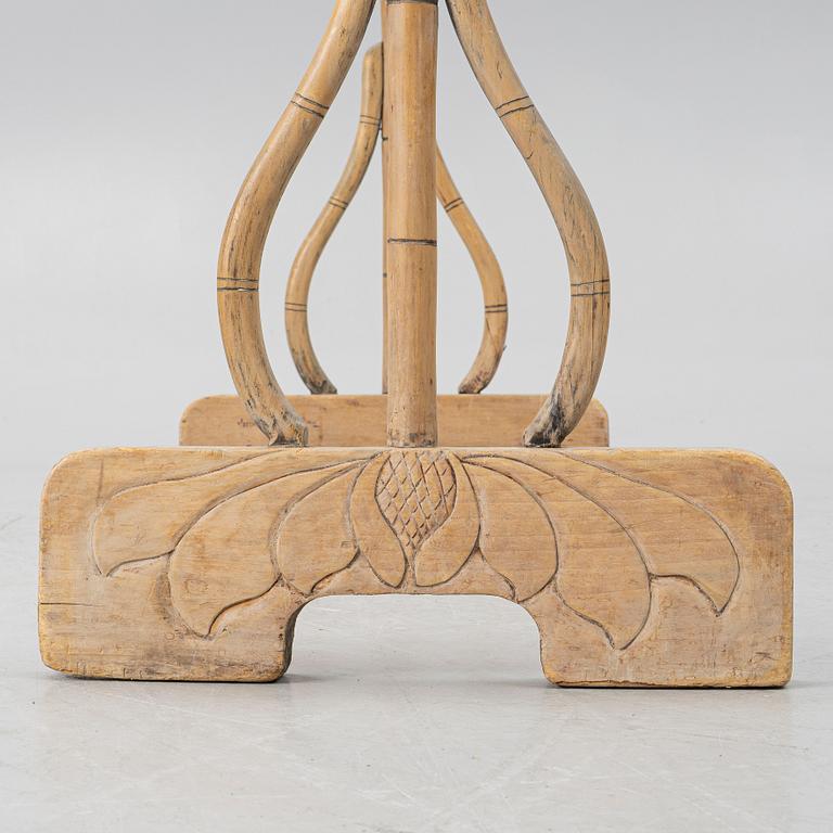 A Chinese bamboo and hardwood clothes rack, 20th century.