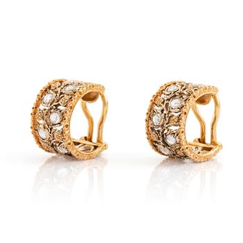 A pair of 18K gold Buccellati earrings set with rose-cut diamonds.