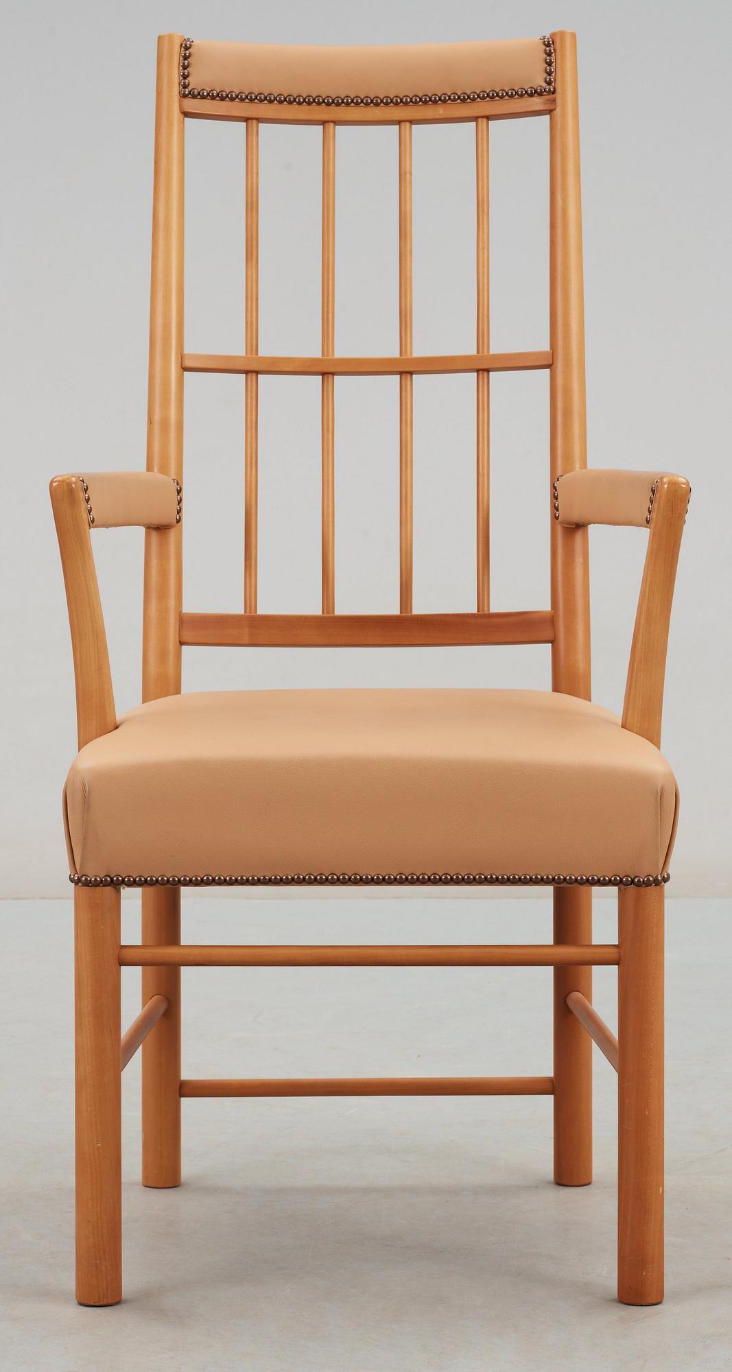 A Josef Frank cherry and beige leather armchair, Svenskt Tenn 2007, model 652.