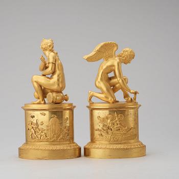 A pair of early 19th century Empire gilt bronze table sculptures.