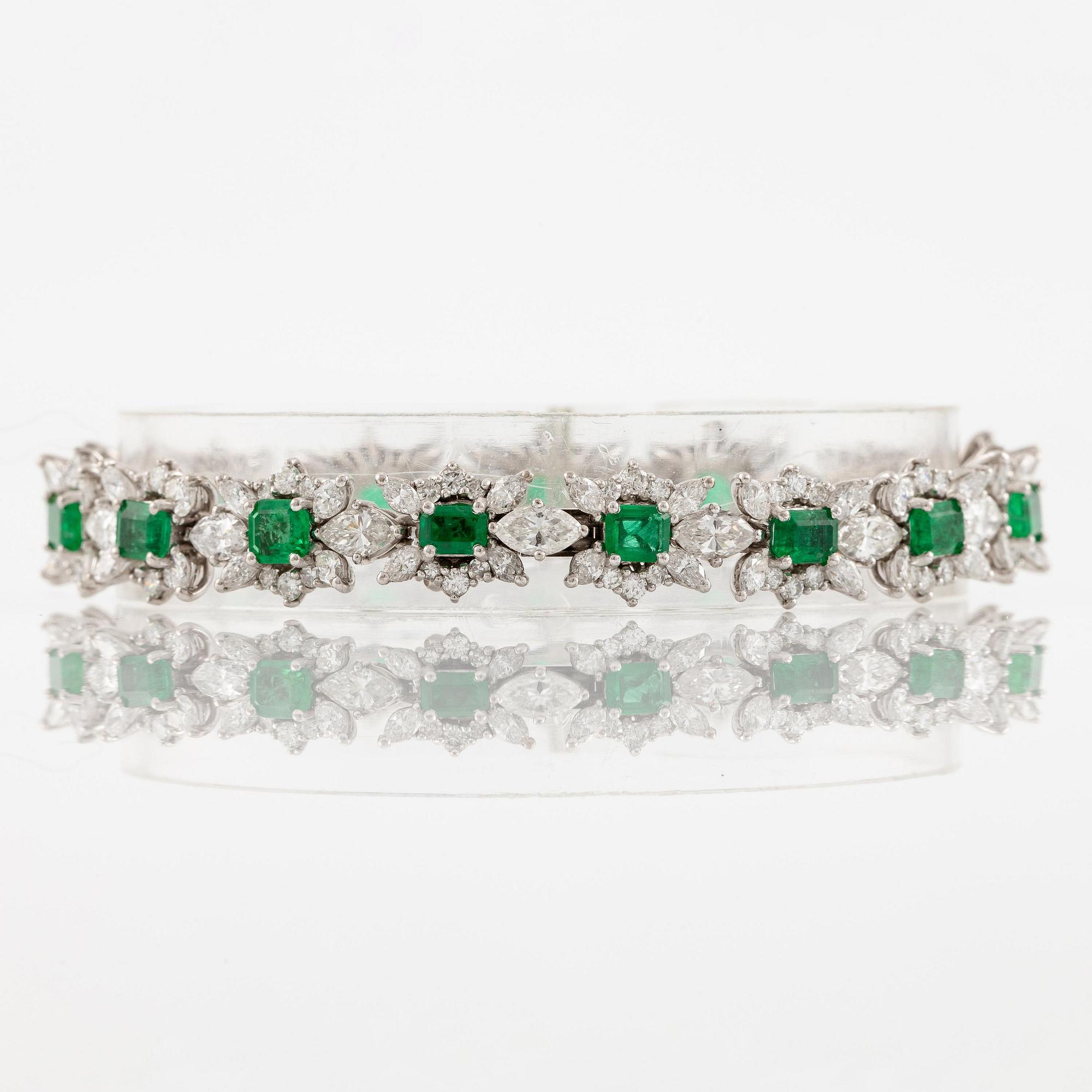 A bracelet in 18K white gold with step-cut emeralds and round and navette-shaped brilliant-cut diamonds.