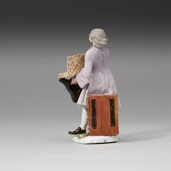 A Meissen porcelain figure of a trinket salesman from the series of Parisian street-traders, circa 1745.