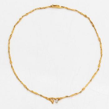 Björn Weckström, An 18K gold necklace "Spring dew" with a ca. 0.08 ct diamond. Lapponia 1979.