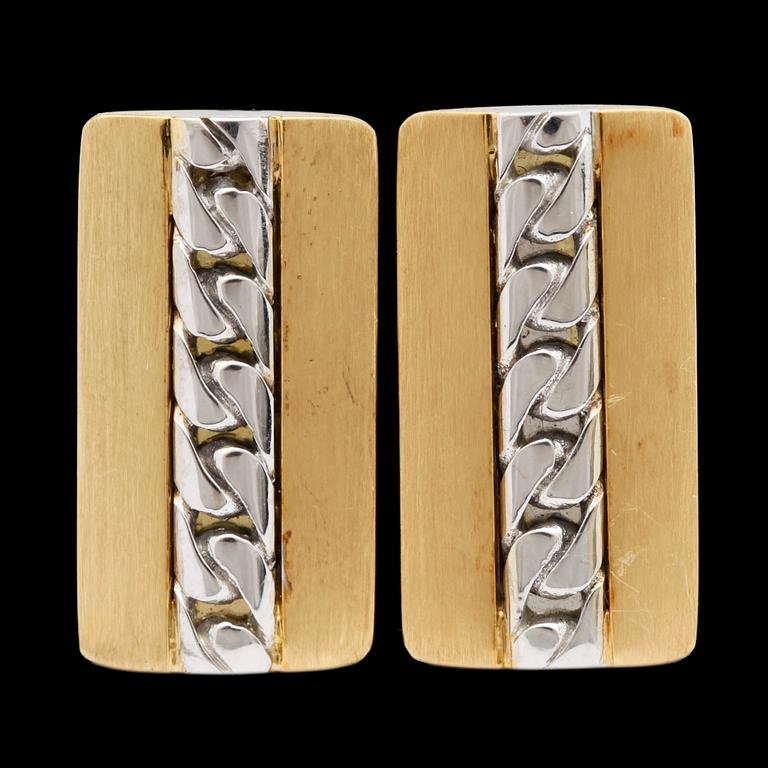 A pair of gold cufflinks.