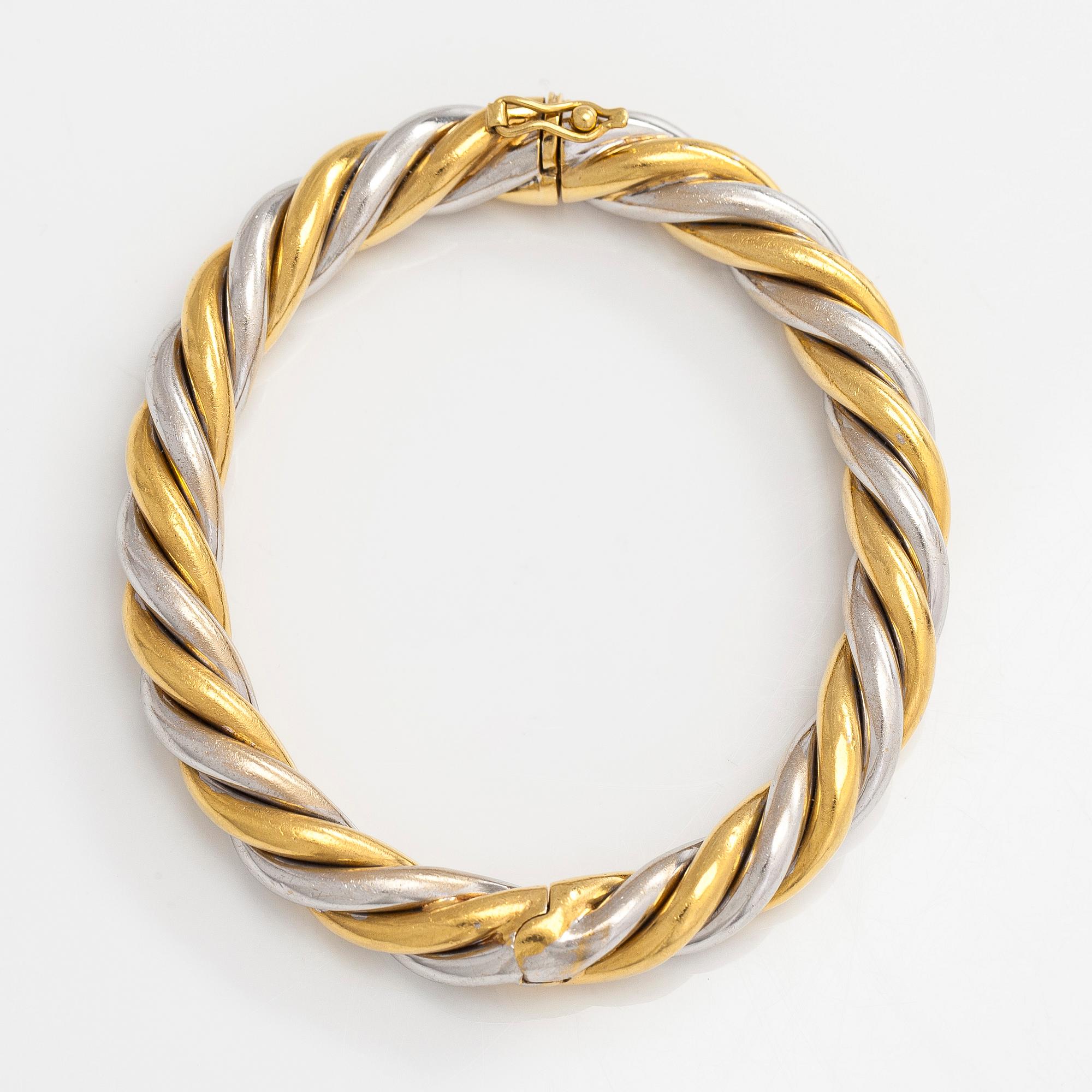An 18K gold/white gold bracelet, Switzerland.