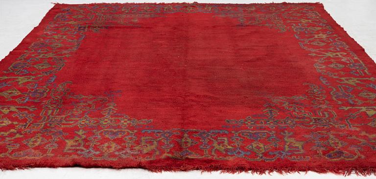 An antique Ushak carpet, West Anatolia, approx. 327 x 250.