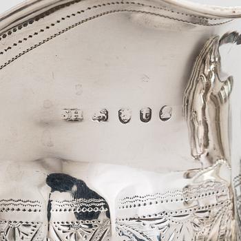 Two sterling silver milk jugs, London 1794 och 1828.