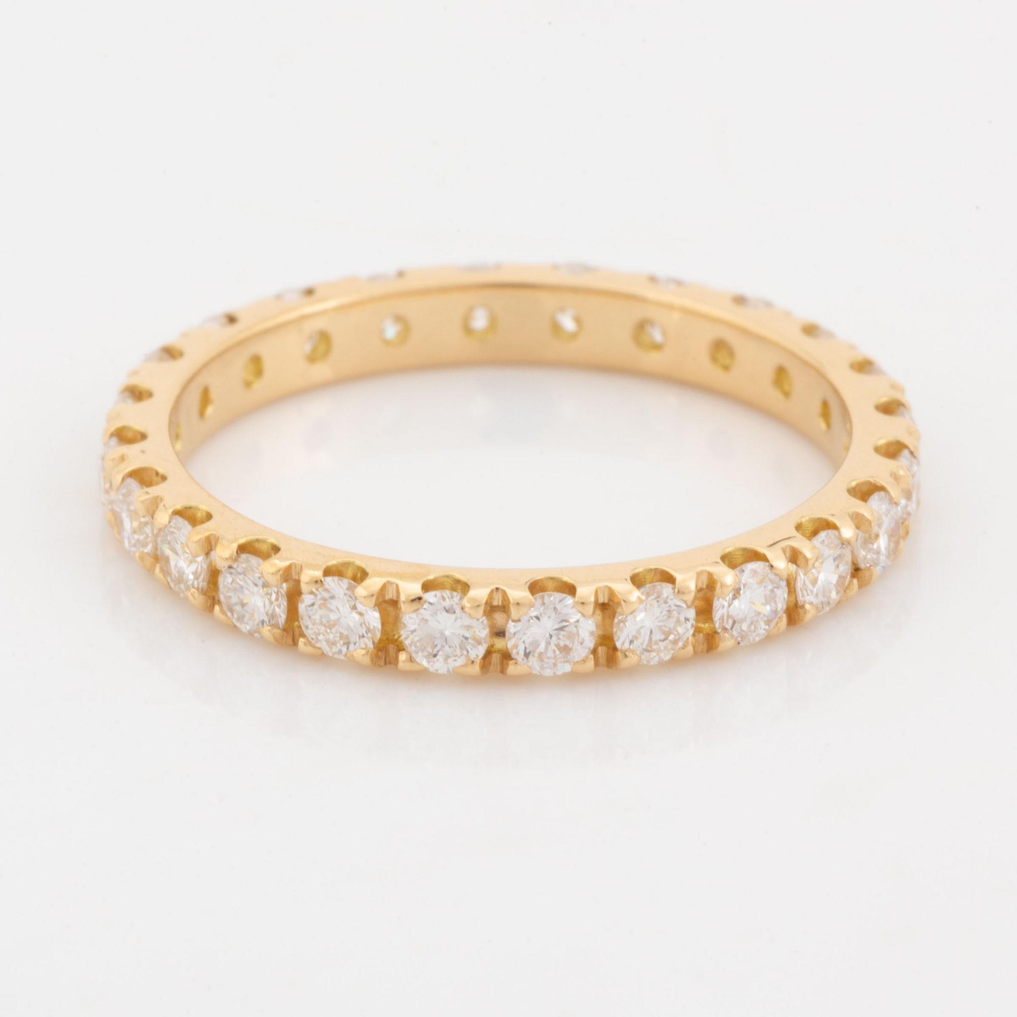 Brilliant cut diamond eternity ring.