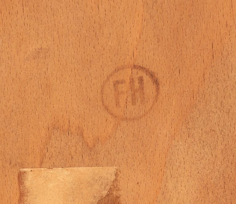 A Hans J Wegner mahogany and beech easy chair, Denmark 1950's.