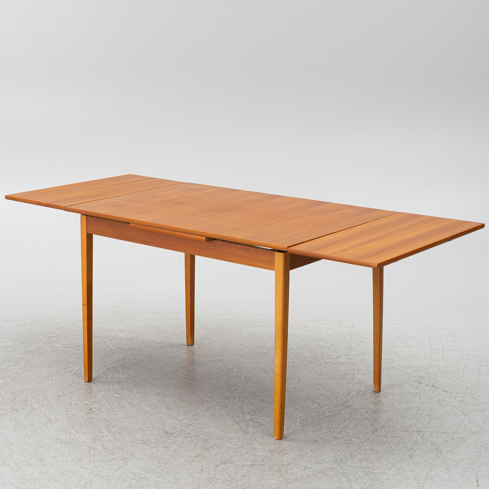 A mid20th century dining table.