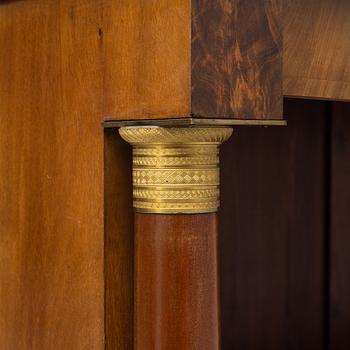 Two similar Empire style book cases, first half of the 20th century.