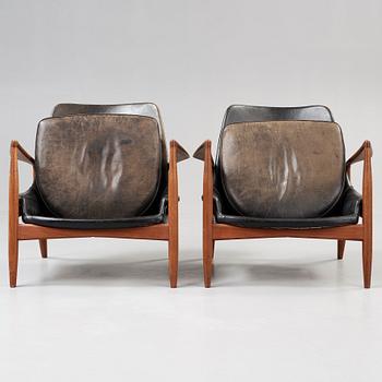 A pair of Olof Persson 'Seal' teak and black leather easy chairs, Olof Persson Möbler, Jönköping 1950's-60's.