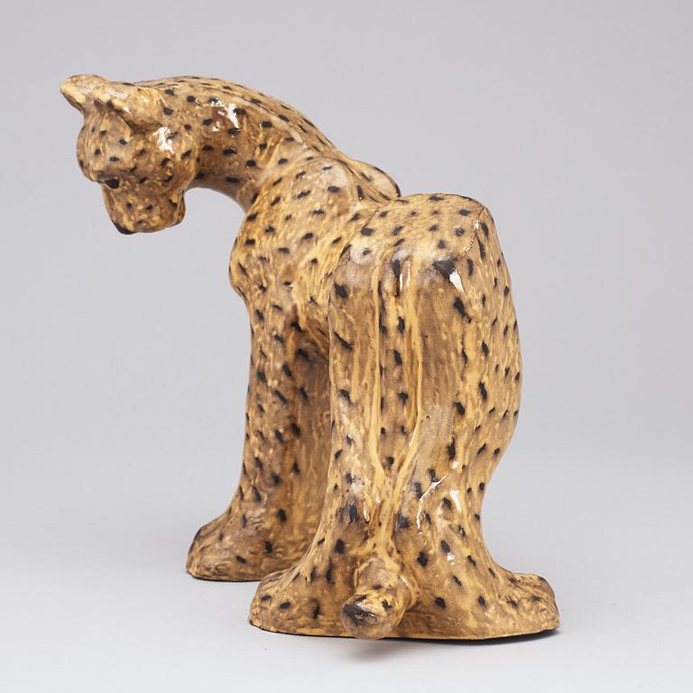 A Vicke Lindstrand yellow glazed ceramic figure of a cheetah, Upsala-Ekeby 1949, model 3003.