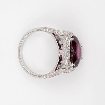 A 6.12 ct heart-shaped rhodolite garnet and brilliant-cut diamond ring. Total carat weight of diamonds circa 0.98 ct.