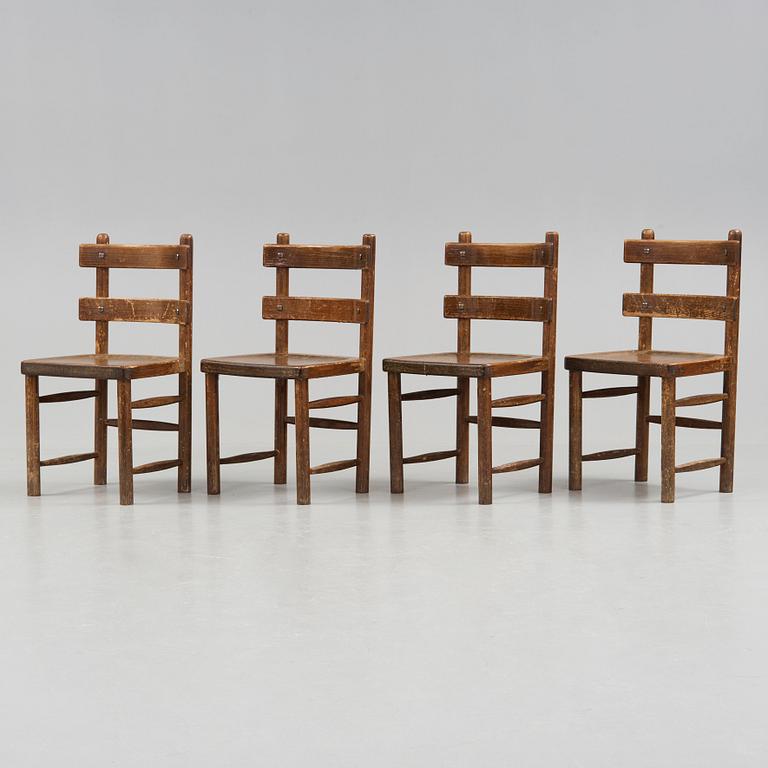 Axel Einar Hjorth, A set of four Axel Einar Hjorth stained and lacquered 'Sandhamn' pine chairs, Nordiska Kompaniet, Sweden post 1929.