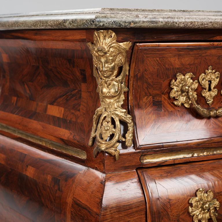 A Swedish early rococo parquetry, ormolu-mounted and marble commode, presumably by S. Pasch or J. Wulf , ca. 1740.