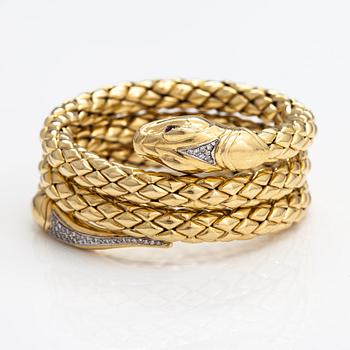 Chimento, An 18K gold snake bracelet with rubies and diamonds ca. 0.46 t in total. Italy.