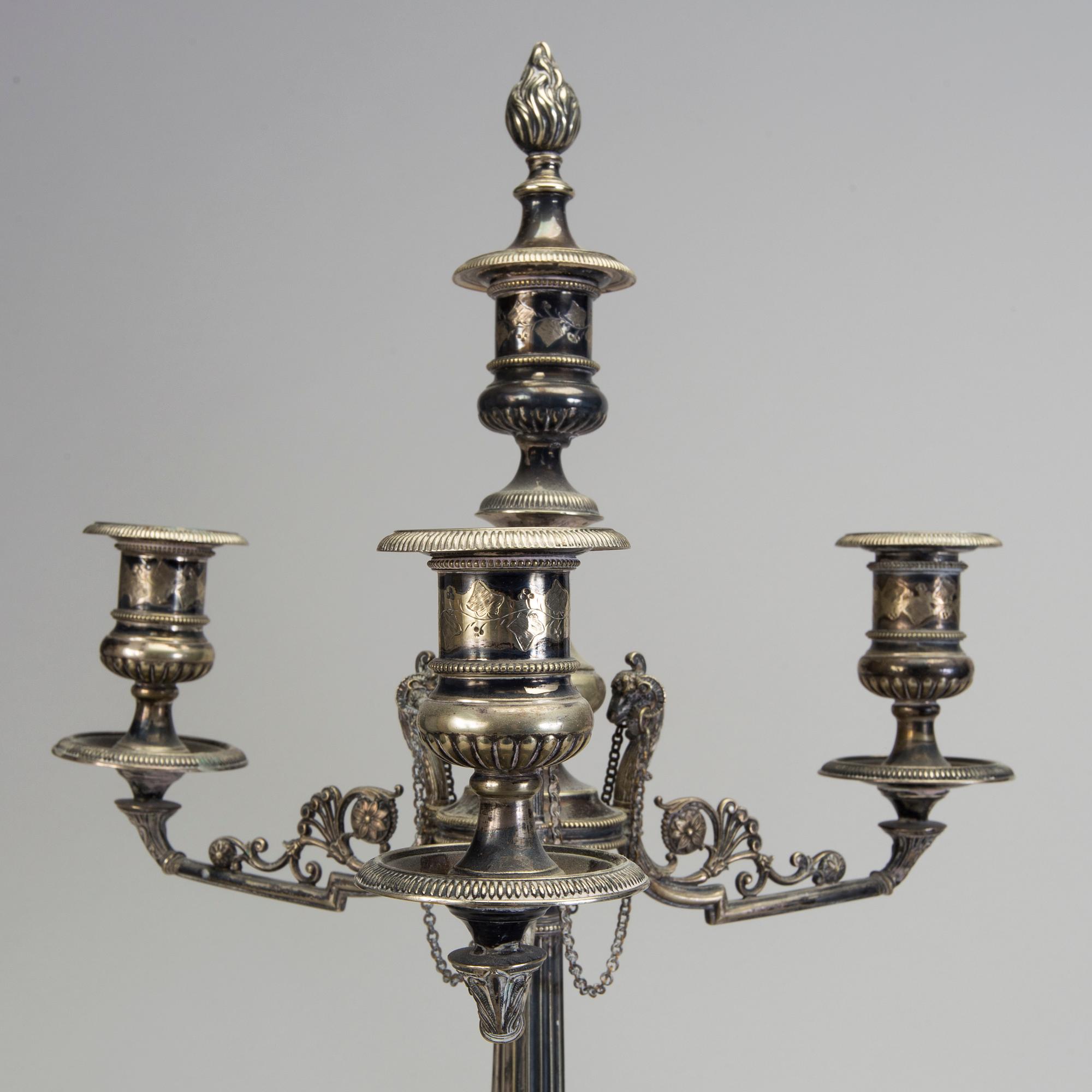A pair of late 19th century silver plated kandelabras by Henry Wilkinson & Co Ltd, Sheffield, England.