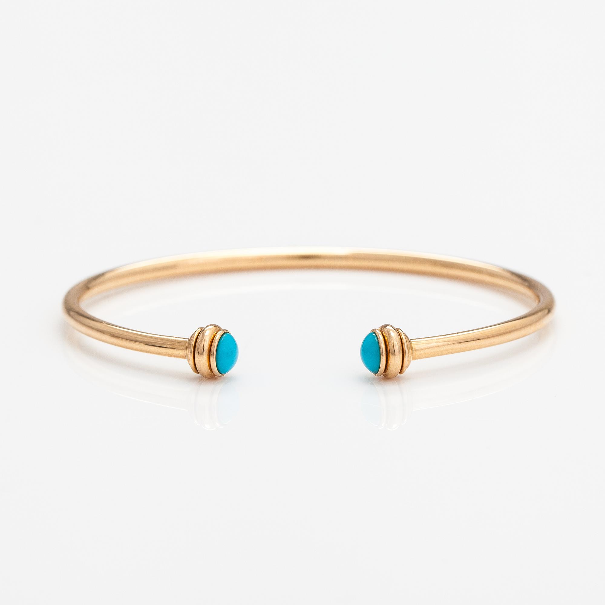 Piaget, A "Possession" bracelet made of 18K gold with turquoises. Marked Piaget R58367, 15.