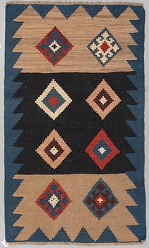 A RUG, possibly a Veramin kilim, ca 173,5 x 102,5 cm.