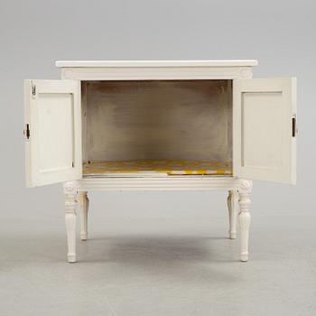 An early 20th century Gustavian style cupboard.