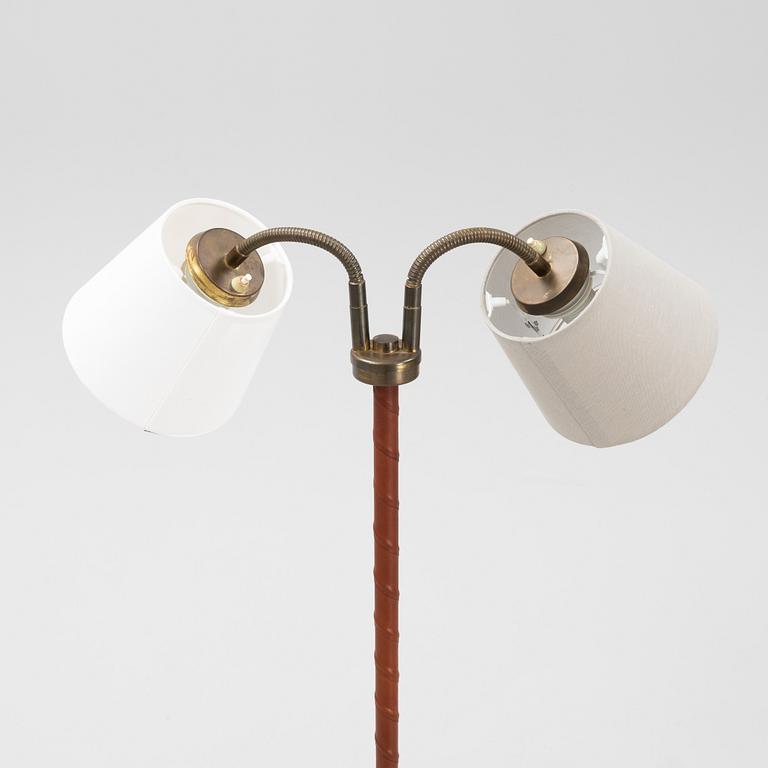 A mid 20th Century double headed floor lamp.