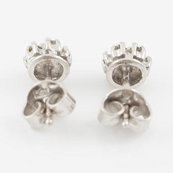 A ring and a pair of earrings in 18K white gold set with round brilliant-cut and octagonal-cut diamonds.
