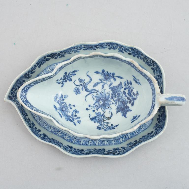 A blue and white vegetable tureen with cover and a sauce boat with a dish, Qing dynasty, 18th Century.