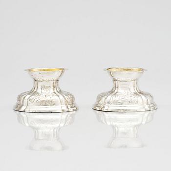 A pair of German rococo parcel-gilt silver salt-cellars, 18th century.