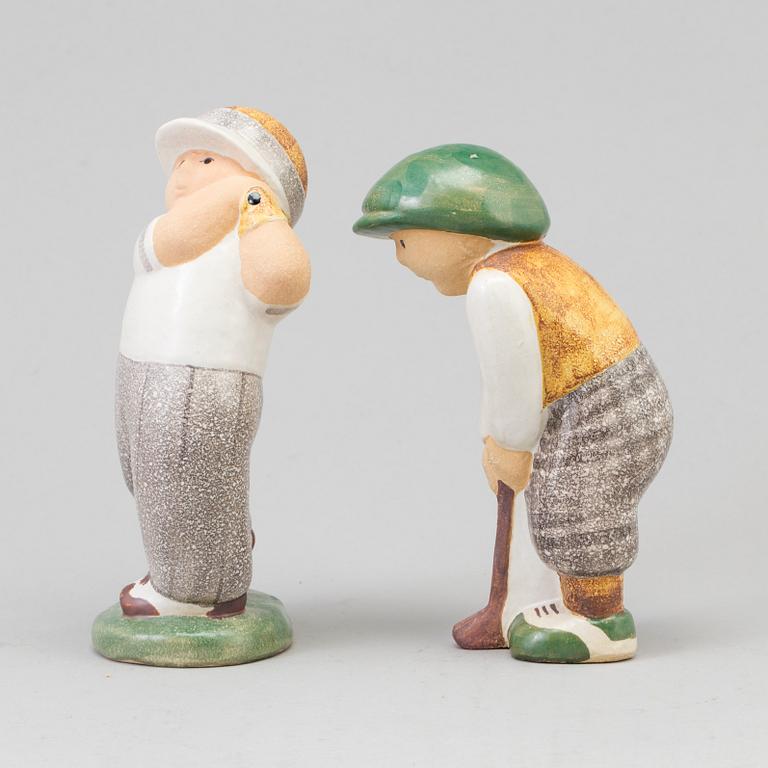 LISA LARSON, a pair of golfer stoneware figurines from Gustavsberg.