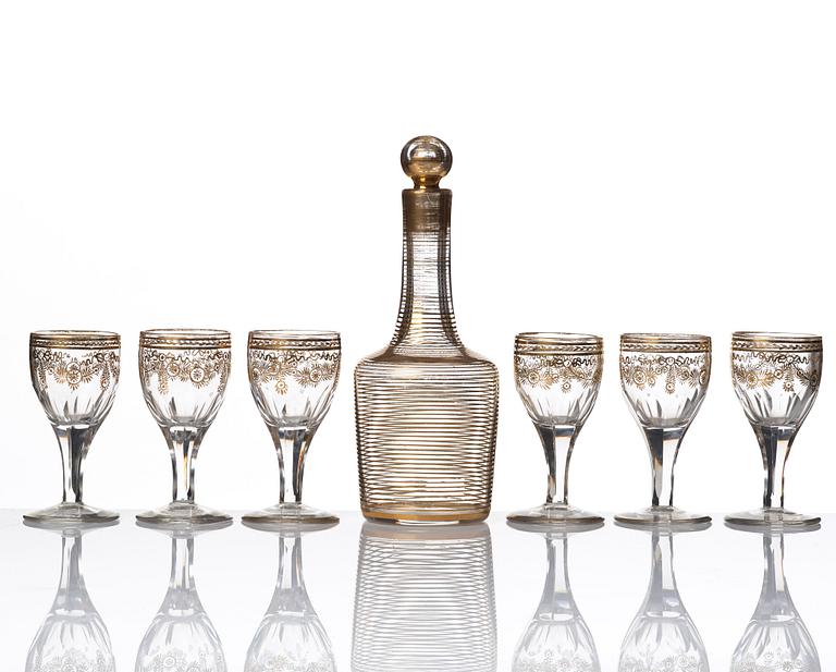 A set of six Russian glass goblets and a bottle with stopper, 19th Century.