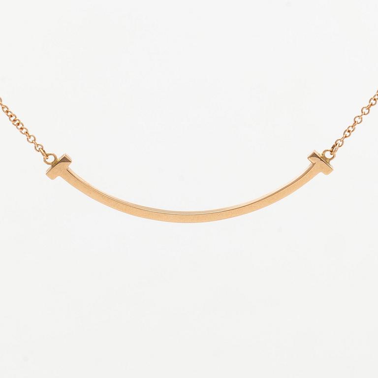 Tiffany & Co, an 18K gold 'T Smile' necklace.